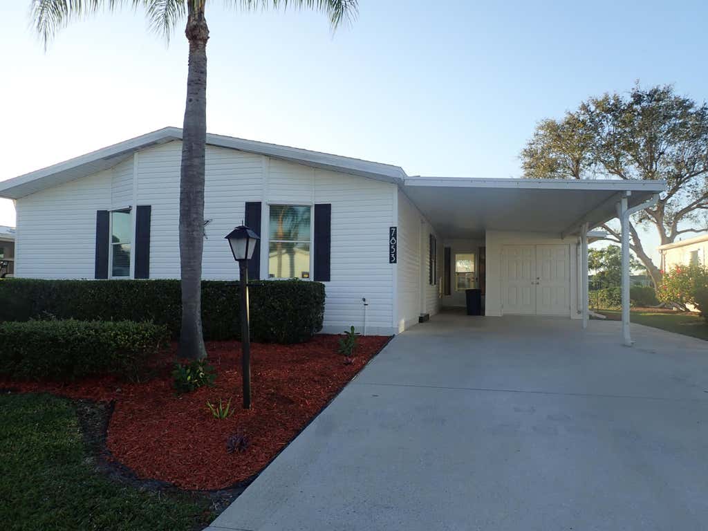 Photo of 7853 Meadowlark Lane, Port Saint Lucie, FL 34952 (MLS # R10961574)