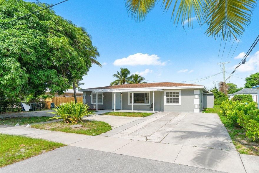 In the heart of Delray Beach! Just a few blocks from the vibrant shops and restaurants of Atlantic Avenue, this stunning 5 bedroom, 3 bath home offers spacious, light-filled living areas with a desirable three-way split floor plan. Enjoy tile flooring throughout, a spectacular primary suite with a generous walk-in closet, and a chef's kitchen featuring abundant cabinetry and storage. The expansive yard provides ample space for your boat, trailer, or outdoor toys--plus a circular driveway for easy parking and guests. Experience the best of life in ''The Village by the Sea,'' one of South Florida's most sought-after coastal communities.