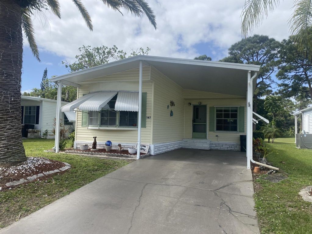 Photo of 147 E Caribbean, Port Saint Lucie, FL 34952 (MLS # R10972071)