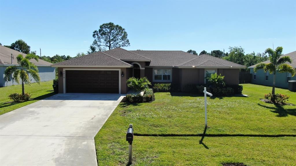 Photo of 5416 NW Bolin Street, Port Saint Lucie, FL 34986 (MLS # R10757265)