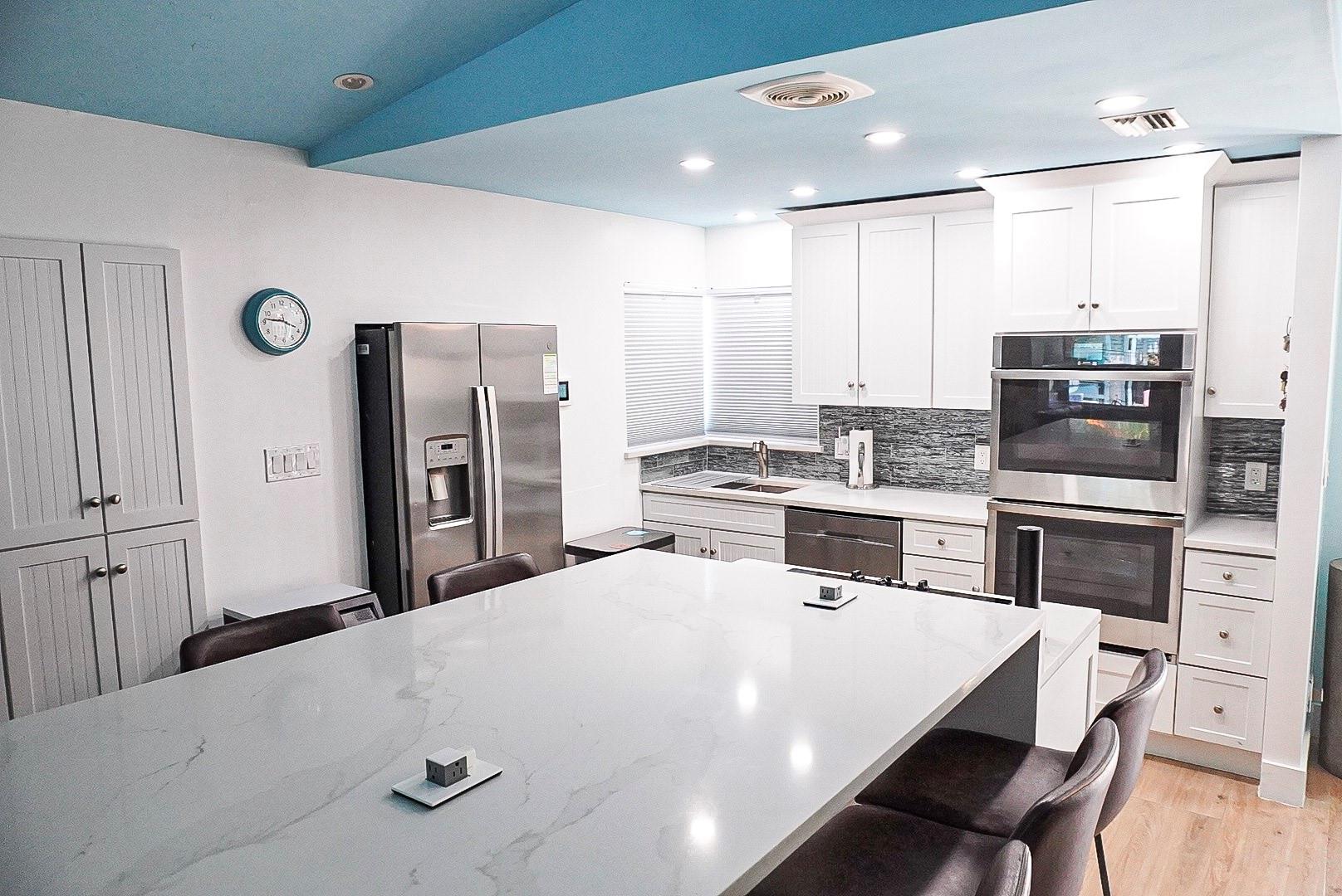 MUST SEE! Stunning contemporary home in the heart of Wilton Manors, just steps from The Drive’s vibrant restaurants, bars, shopping, art scene & more. This fully renovated 3 bed, 3 bath haven features a sleek kitchen with a large island, new tile and vinyl flooring, modern design and generous storage. The show-stopping heated saltwater pool has a modern waterfall, private cabanas, and space for an outdoor kitchen or massages—perfect for entertaining. Relax on the covered porch overlooking your tropical retreat. Whether you're looking for a dream home, vacation rental, film or content shoot location, or the ultimate pool party space, this home delivers style, comfort, and unbeatable location, just 3 miles from the beach!