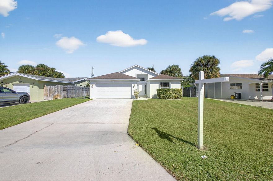 Very rare opportunity to own a 2005 built 4 bedroom CBS home in Palm Beach Gardens Estates. 2 bathrooms and 2 car garage. Tall ceilings. Covered patio. Fully fenced backyard. Split floor plan. Floors need to replaced as there are broken tiles. AC is 2016 with UV light. Water heater 2022. Newer garage door with epoxy floor. Full accordion shutters. Roof is original. Master bathroom has double sink vanity, soaking tub, and walk-in shower. Master bedroom has a walk-in closet. A majority of homes in this community were built from 1960 to 1980, making this one of the newest homes on the block.