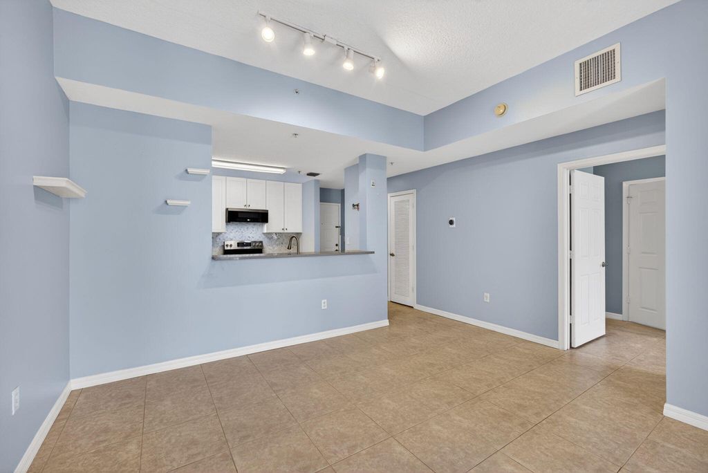 Photo of 1203 Town Center Dr #308, Jupiter, FL 33458 (MLS # B26030628)