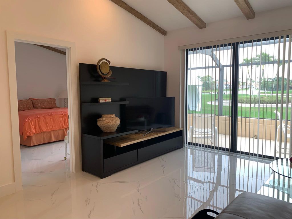 Photo of 451 Prestwick Circle, Palm Beach Gardens, FL 33418 (MLS # R10963893)