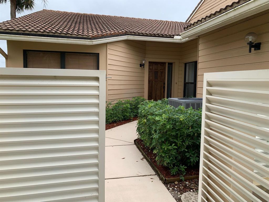 Photo of 451 Prestwick Circle, Palm Beach Gardens, FL 33418 (MLS # R10963893)