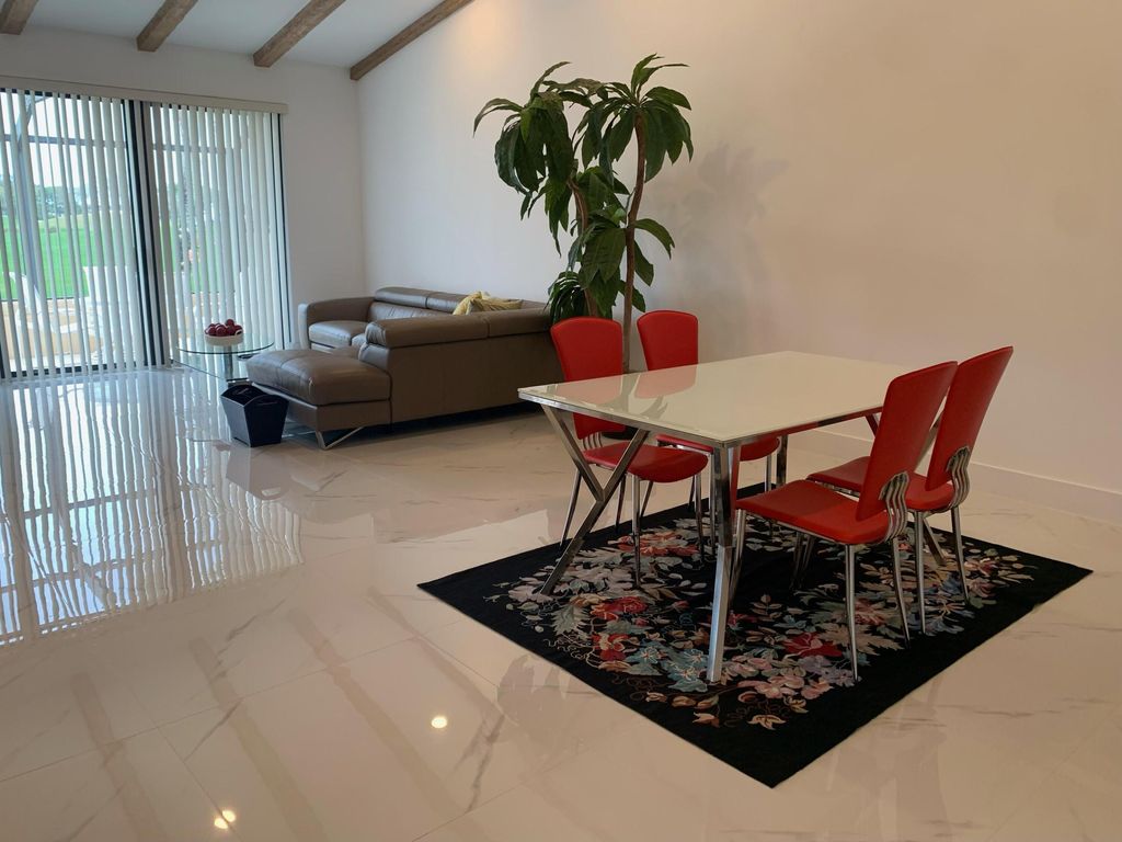 Photo of 451 Prestwick Circle, Palm Beach Gardens, FL 33418 (MLS # R10963893)