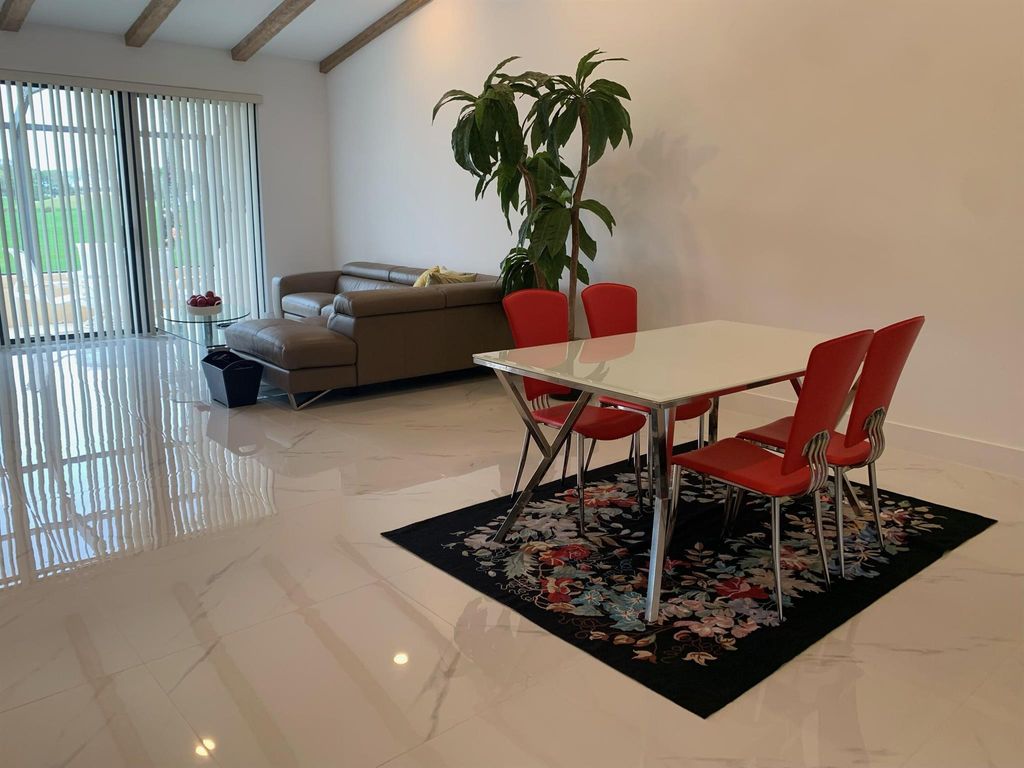 Photo of 451 Prestwick Circle, Palm Beach Gardens, FL 33418 (MLS # R10963893)