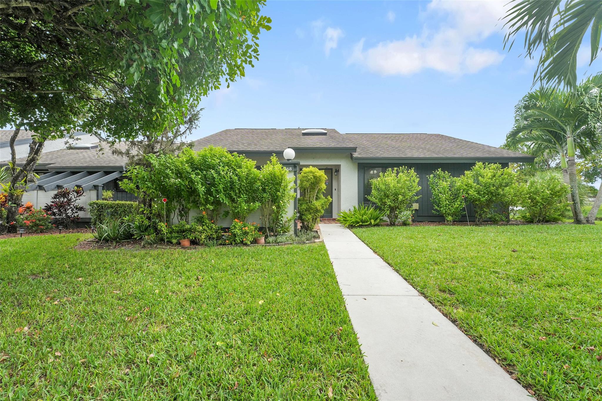 Updated 3BR/2BA end unit in the sought-after Strathmore Gate West community of Royal Palm Beach! This home features Impact Windows & Doors, Washer/Dryer in-unit, and convenient parking directly out front. Enjoy a bright, open layout in a quiet, peaceful setting. Strathmore Gate West offers two heated pools, fitness center, and more—perfect for an active yet relaxed lifestyle. Ideally located close to shopping, dining, highways, and everything you need. Move-in ready and beautifully maintained, this home combines comfort, convenience, and community in one exceptional package!