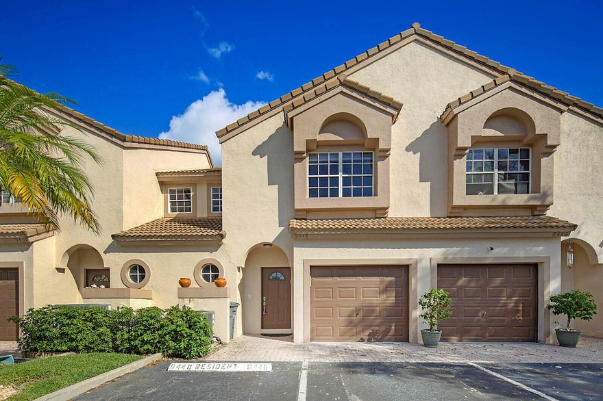 Welcome to this beautifully upgraded 3-bedroom, 2.5-bath townhome in the sought-after gated community of Coral Lake in West Boca! Rarely available and full of charm, this light-filled home features an open-concept layout with soaring vaulted ceilings and skylights that create a bright, airy feel from the moment you walk in. Recently refreshed with brand-new flooring, fresh paint, updated baseboards, and smooth ceilings (no popcorn!), it's truly move-in ready. The stylish kitchen shines with solid wood 42'' cabinets, granite countertops, a full granite backsplash, a raised counter bar, and custom cabinetry that adds valuable extra storage. Upstairs, the double-door entry welcomes you into a spacious master suite with a beautifully redesigned master bath. The oversized 2nd and 3rd bedrooms