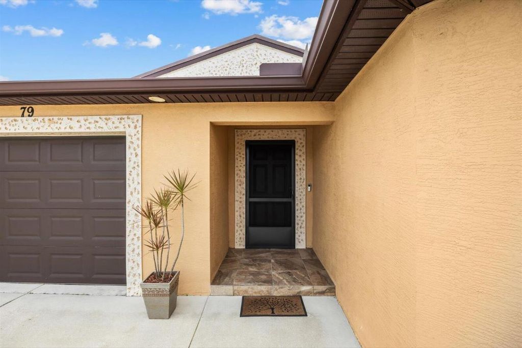 Photo of 79 Flores Del Norte, Fort Pierce, FL 34951 (MLS # R11155009)