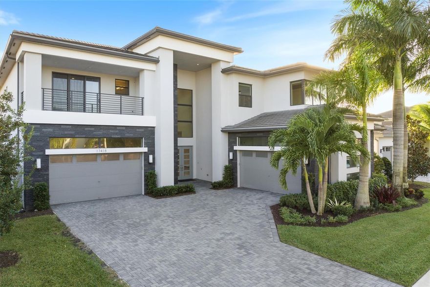 This stunning contemporary Riverside model located in Boca Bridges is a dream come true. Featuring 5 bedrooms/ 6.1 baths, this home & community are designed to exceed your expectations. The grand foyer sets the tone with it's soaring ceilings & exquisite lighting that transition to the gourmet kitchen & dining areas w/surround sound & wood floors throughout. Upgraded cabinets, appliances & ample counter space create a chef's paradise. Also offered on the 1st floor is a club room w/secondary bar & cabana bath off the expansive pool adorned w/cascading fountains. The primary suite & additional spacious bedrooms all offer their own luxurious ensuite bath & abundant closet space.  BB features a clubhouse, fitness center, tennis-pickelball & endless opportunities to explore new interests!