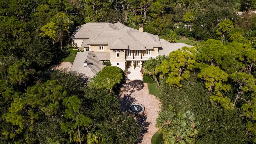 Offering exceptional views of 10th and 11th holes of the Jack Nicklaus Signature golf course at The Bear’s Club this four bedroom, five full & one half bath residence offers nearly 6,700 ac/sf of living space. The home also features a large paneled library and a combination billiards/club room located off of the family room. This Lavelle Construction built residence offers West Indies inspired exterior elevations with clean transitional interiors.  The property totals 1.22 acres with a large rear yard and pool area providing allowing for both golf views and privacy. The lot offers ample remaining footprint to add additional square footage.