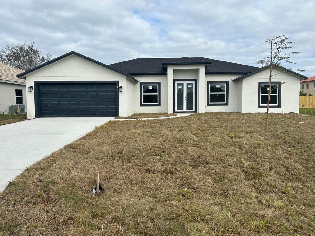 Photo of 1402 SW Santiago Avenue, Port Saint Lucie, FL 34953 (MLS # R10978181)