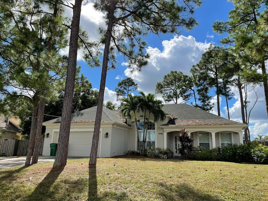 Photo of 1732 SW Booth Avenue, Port Saint Lucie, FL 34953 (MLS # R10761441)
