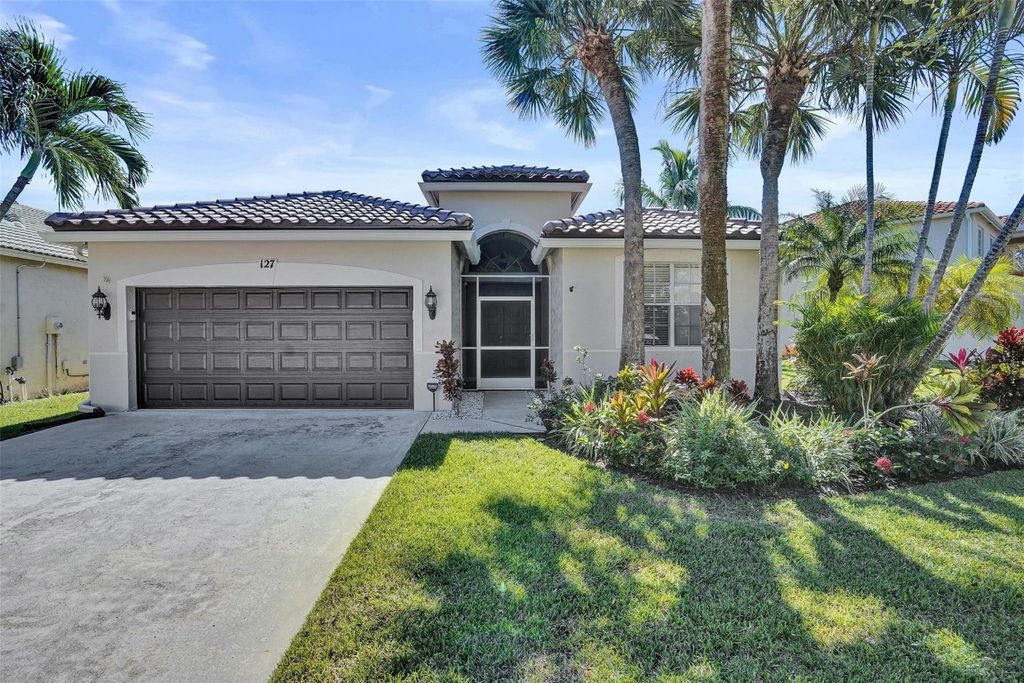 Photo of 127 Seminole Lakes Drive, Royal Palm Beach, FL 33411 (MLS # F10534753)