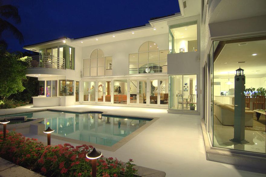 Incredible Gated Direct Intracoastal Contemporary Estate located only blocks to the Beach and ''Knock your socks off'' views! Features Open Floor plan, Soaring Ceilings, Walls of Glass, great bar area, Gorgeous Large Kitchen with clean white cabinets and white Quartz Counters,  family room, 2 Bedrooms downstairs, 4 Bedrooms up-Master featuring his & her baths, incredible closets, separate ''yoga/pilates/barre'' room off master, separate staircase and entrance to ''nanny'' suite, Elevator, Terrific Pool/ Patio with Retractable Awning, No Wake Zone and Minutes to the Boca Inlet for the Boater