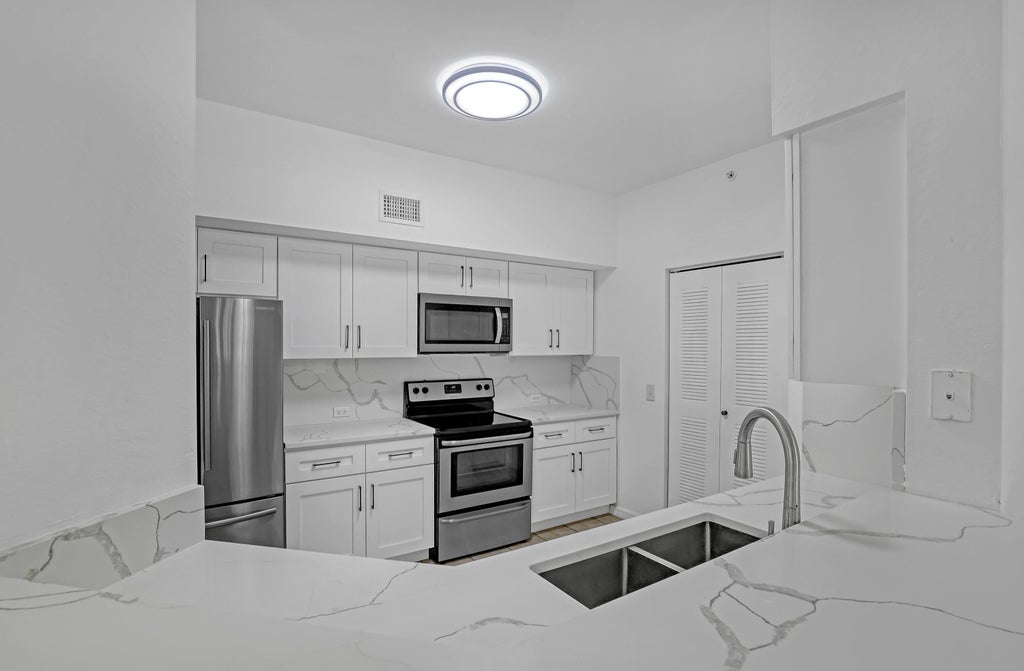 Photo of 340 Crestwood Circle #302, Royal Palm Beach, FL 33411 (MLS # B26033223)
