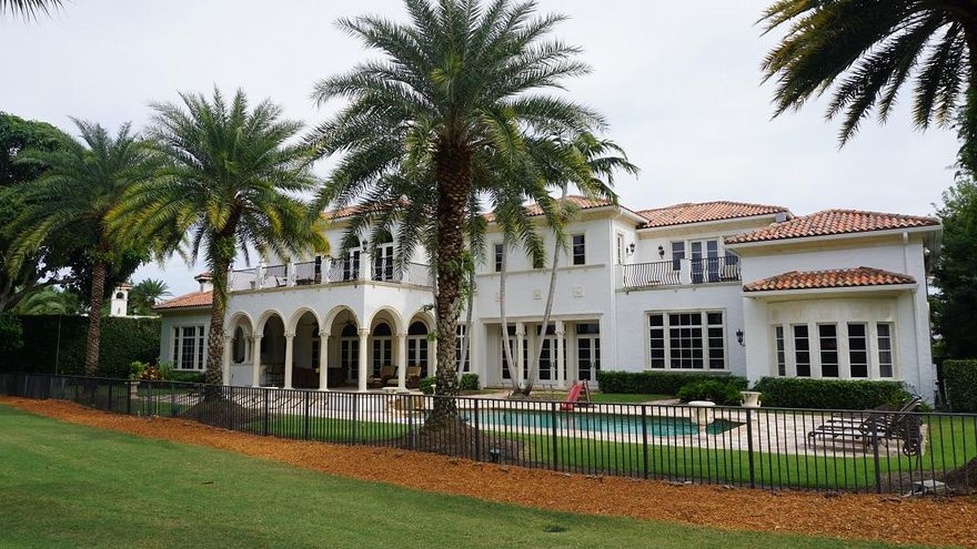 Buyer to pay doc stamp taxes on deed and title insurance. Golf course estate in Royal Palm Yacht & Country Club on 171ft of golf course frontage with views from almost every room. Home features grand foyer entry with custom stone staircase, formal living and dining rooms, clubroom with wet bar overlooking pool and golf course, private office and movie theater, gourmet kitchen with top-of-the-line appliances, wine room and large walk-in pantry. 1st floor master suite with sitting area, his & her baths, and his & her closets. Home features an elevator, front & back staircases and more! Gorgeous outdoor space including heated pool with elevated spa and natural marble deck, covered loggia with wet bar & BBQ, and an Old Chicago brick paver driveway with a 4 car garage plus golf cart.