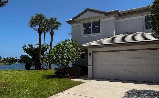 Photo of 7780 STONE HARBOUR Drive #4, Lake Worth, FL 33467 (MLS # B26064710)