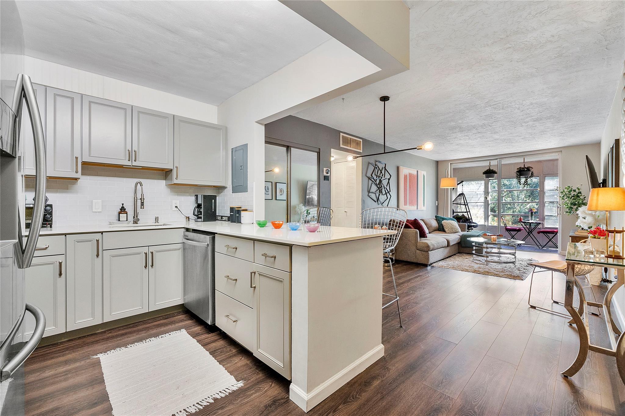 Only 3% down for qualified first time buyers. Exquisite fully remodelled condo, open floor plan & an extra room/porch which is great as an office. Lots of closet space. Kitchen boasts S/S appliances, quartz countertops with a beautiful island. Spa like bathroom with rain shower. A/C 2020. Nest thermostat. The community has 2 tennis courts, 2 pools, a jacuzzi, sauna, gym, theatre, billiards, shuffle, library & much more. Low HOA which includes water, trash removal sewer & pest control. The condo comes with one parking space & lots of guest parking. Laundry just down the hall. This condo is conveniently located near the Broward Mall, lots of good restaurants, the Turnpike and Starbucks. Also 15 mins from Nova University. No special assessments, 50 year certification has been completed.