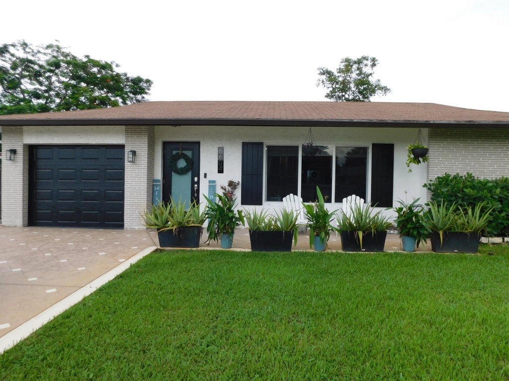 Photo of 6604 NW 93RD Avenue, Tamarac, FL 33321 (MLS # B26075731)