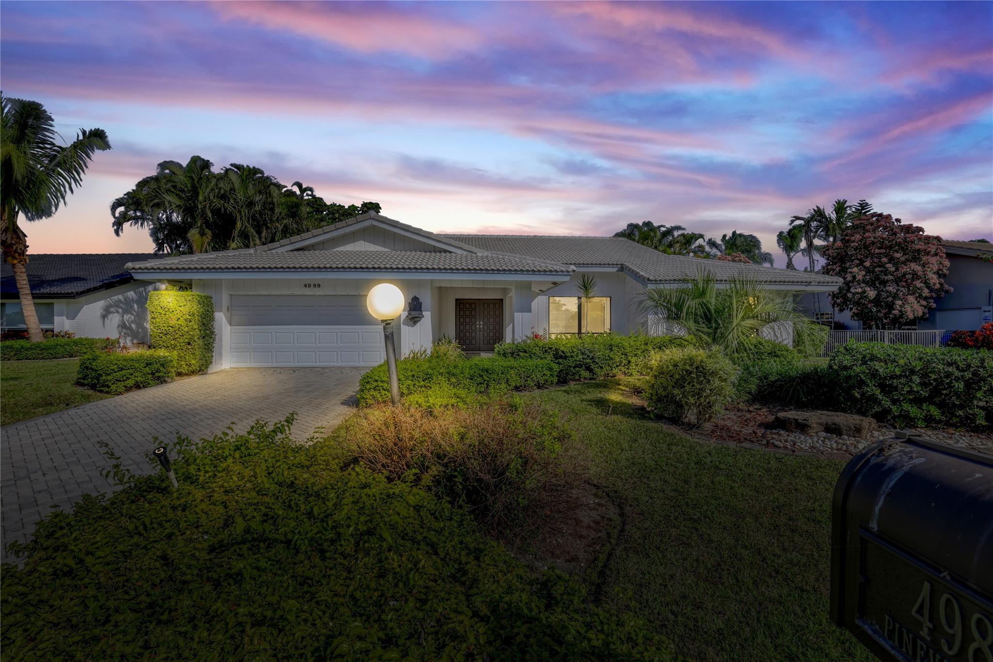 Stunning lakefront home, with great privacy, and a spacious open concept layout in the prestigious, and private guarded Seagate country club. Located 5 minutes from Delray’s beach, Atlantic Ave & I95. Aside from the flawless location of this property, as well as the 3 bedroom plus a den, 2.5 bathroom, 2 car garage with entry for a golf cart, you will also enjoy a lake-view from almost every angle of the home that is sure to please. The high vaulted ceiling is a masterpiece. The backyard is filled with banana, mango, starfruit, and avocado trees. Host an impressive gathering in your backyard that boasts open space, patio, grass, and the expansive view that can only be found in select properties.