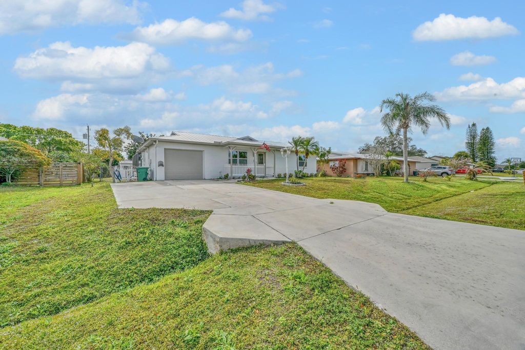 Photo of 520 NW Azalea Avenue, Port Saint Lucie, FL 34983 (MLS # R11159859)