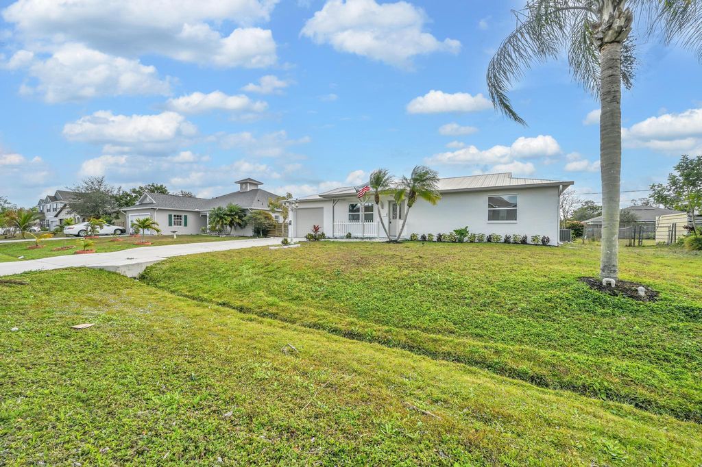 Photo of 520 NW Azalea Avenue, Port Saint Lucie, FL 34983 (MLS # R11159859)