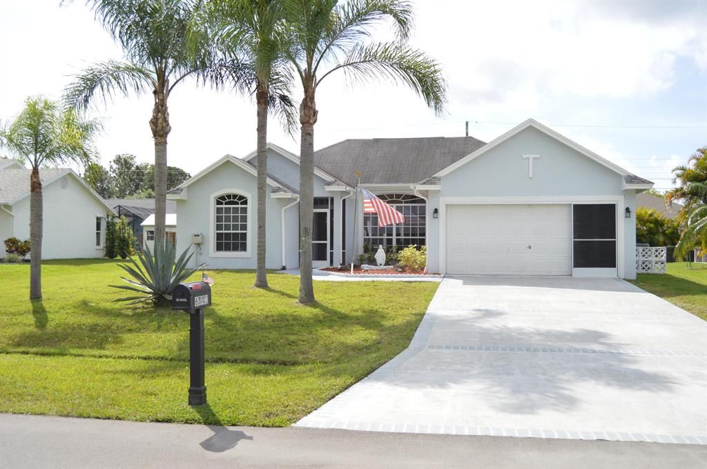 Photo of 6841 NW Hogate Circle, Port Saint Lucie, FL 34983 (MLS # R10786210)