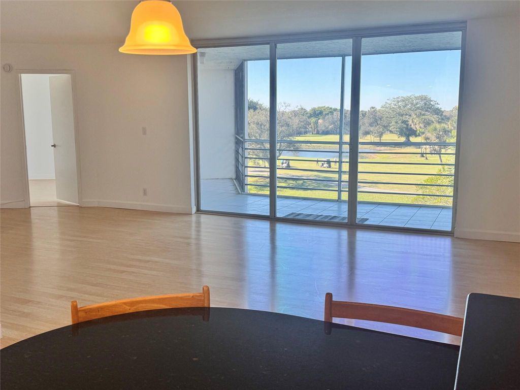 Photo of 3980 Oaks Clubhouse Drive #405, Pompano Beach, FL 33069 (MLS # F10543675)