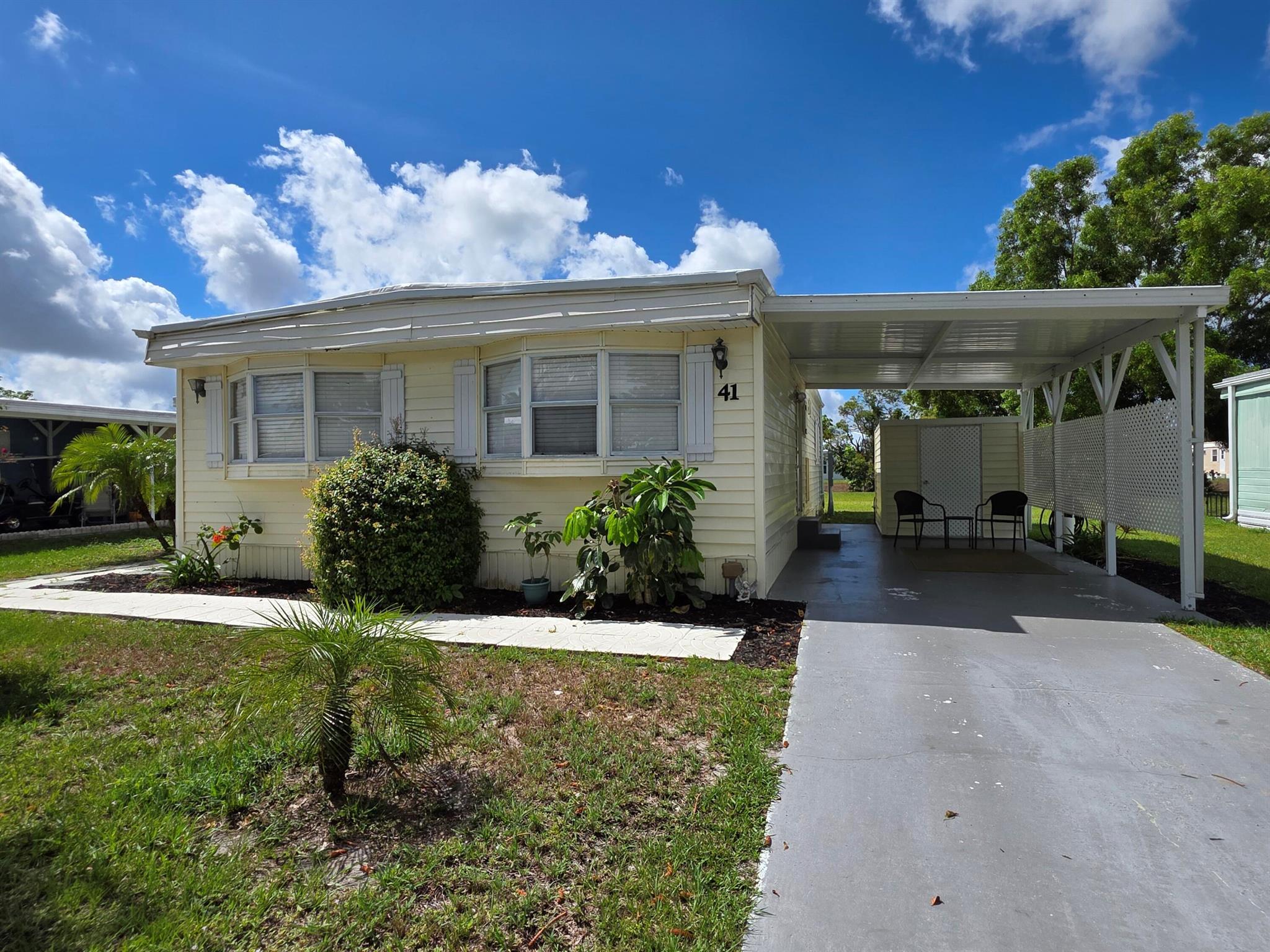This beautifully maintained manufactured home has a recently replaced roof and upated A/C unit plus it comes fully furnished all nestled on an oversized lot with canal views. Located in the 55+ community of Spanish Lakes One. This move-in ready home offers the perfect blend of comfort, convenience, and Florida charm. Step inside to discover a bright and airy floor plan that flows effortlessly, with inviting living spaces and tasteful furnishings throughout. Enjoy peaceful mornings on your spacious screened porch overlooking the water - the perfect spot for your morning coffee. Situated on one of the larger lots in the community, you'll appreciate the extra outdoor space for entertaining and enjoying the serene surroundings. (Lot Lease of 910.60/month)
