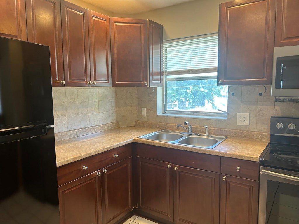 Photo of 3930 CRYSTAL LAKE Drive #316, Deerfield Beach, FL 33064 (MLS # B26064315)