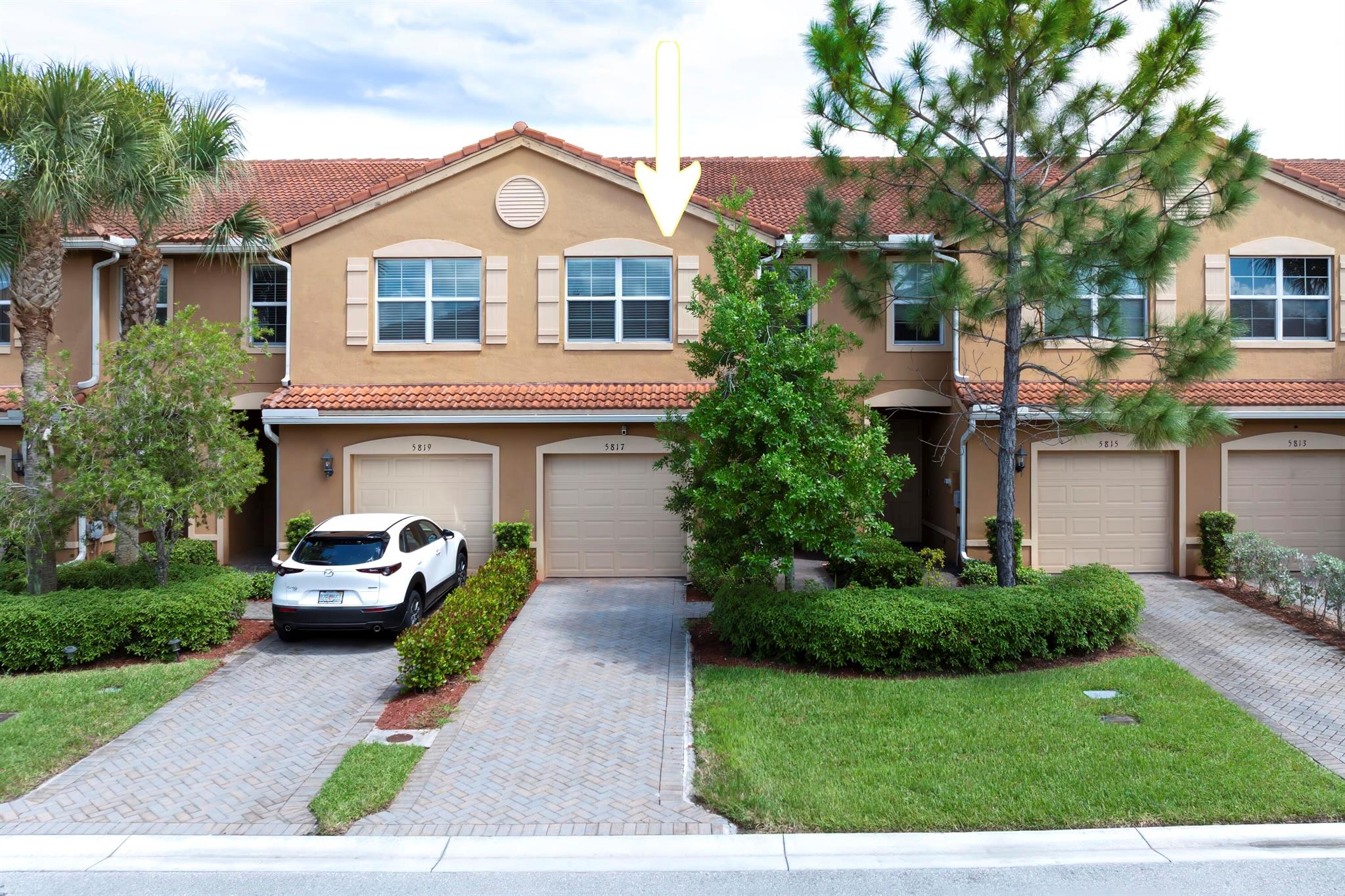 Welcome to your dream property located perfectly between the vibrant Downtown Lake Worth Beach and the tranquil horse country of Wellington. This home offers the ideal mix of comfort and convenience. Step into a spacious 3-bedroom, 2.1-bathroom haven featuring tile and laminate flooring throughout. Whether you're hosting friends or enjoying a quiet evening, the open floor layout easily accommodates any lifestyle. Dive into relaxation with access to a community pool and clubhouse where you can unwind or spend quality time engaging in activities. The home's 1-car garage offers convenience and additional storage space.