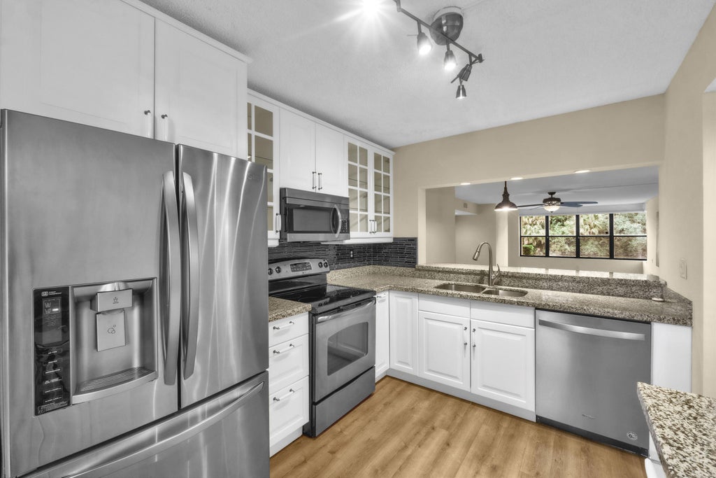 Photo of 2908 S CARAMBOLA Circle S #106, Coconut Creek, FL 33066 (MLS # B26089244)