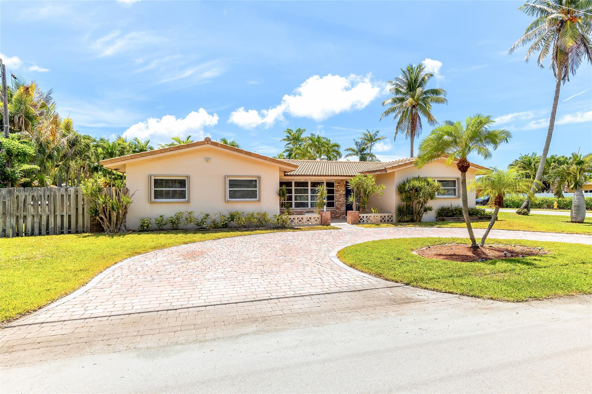 Spacious 5 Bed/3 Bath home in the heart of Lighthouse Point. Great location directly across from Frank McDonough Park which has tennis courts, basketball, volleyball, soccer, playground and picnic area. Only one access point to this secluded island community which has its own police department and great amenities. The home boasts a spacious living and dining room when you enter. Kitchen with granite counters and stainless appliances looks out to large enclosed Florida room which is great for entertaining. Large utility room with washer, dryer and bonus refrigerator. This is a perfect home for a large family that wants the privacy and amenities that come from living in Lighthouse Point. Short bike ride or golf cart trip to the LHP Yacht Club, Beach and Restaurants!
