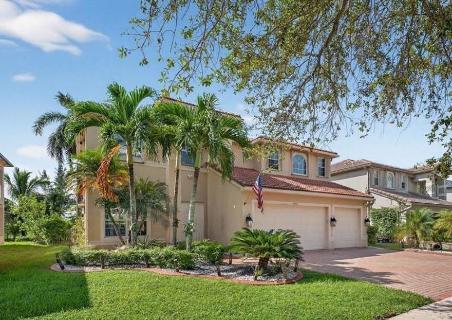 Beautiful 6 Bedroom currently being used as 5 Bedroom and 4 Bathroom home w/pool & canal views! Features double-door entry, 3-car garage & S-tile concrete roof. 1st floor offers wood-look porcelain tile, spacious living & dining rooms w/tray ceilings, gourmet kitchen w/wood cabinets, SS appliances, granite counters, pantry & breakfast area. Full bed & bath downstairs. Primary suite boasts tray ceilings, walk-in closets & luxury bath w/Jacuzzi, shower & dual vanities. Two en-suite bedrooms upstairs. Backyard oasis w/pool, child safety fence, pavered patio, fruit trees & privacy hedge. Easily convert back to 6BR. Hurricane shutters, laundry room w/sink, cabinets & W/D.