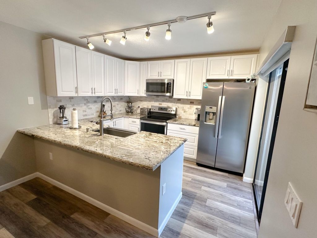 Photo of 3078 SW Sunset Trace Circle, Palm City, FL 34990 (MLS # R10958366)