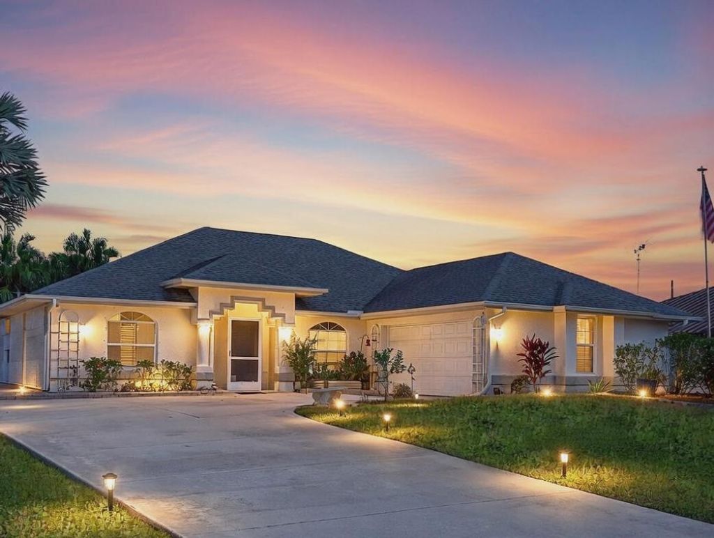 Photo of 1149 SE Cambridge Drive, Port Saint Lucie, FL 34952 (MLS # R11155515)