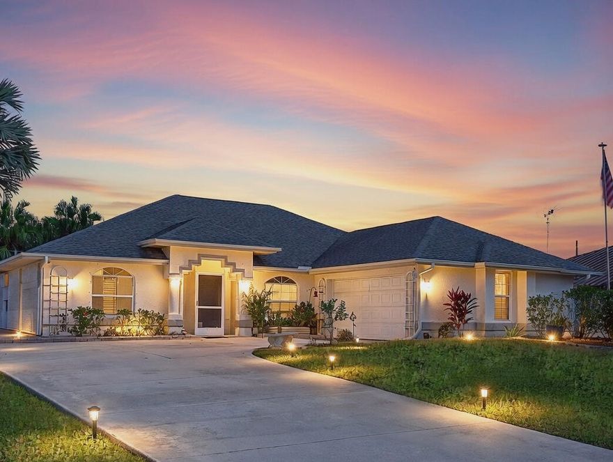 Welcome home to this Sandpiper Bay residence built in 1994 with solid CBS construction. This well-maintained 3-bedroom, 2-bath, 2-car garage home offers 1,591 sqft of living space with a functional split-bedroom layout designed for comfort and privacy. The property offers attractive curb appeal with mature landscaping and a hummingbird garden. Double French front doors lead into the open great room featuring a vaulted ceiling, custom fans, laminate wood-look flooring, and large 3-panel pocket sliding glass doors leading to the expansive screened lanai, creating a seamless indoor-outdoor living area. 
The kitchen features a galley-style layout with a breakfast nook and French doors leading to the lanai and 12'' x 24'' porcelain tile laid on the diagonal in select areas. All newer GE fingerprint- and smudge-resistant appliances are included. 
The split floor plan places the primary suite privately at one end of the home. It features a tray ceiling, split vanities, a separate tub and shower, and a cabana door to the lanai with access to an outdoor shower. Two additional bedrooms are located on the opposite side of the home, with one currently configured as a home office with double glass doors. A central vacuum system replaced in 2023 services the home, providing efficient and convenient cleaning. A hard-wired Blink security system provides added peace of mind. The screened lanai overlooks a 15' x 30' heated saltwater pool, an uncommon size suitable for lap swimming and year-round use. The pool is equipped with an energy-efficient heater installed in 2021 and a new pool pump in 2025. The backyard is enclosed by a vinyl white privacy fence, offering a quiet and private outdoor setting. The L-shaped two-car garage features an epoxy-coated floor, and the home includes a 2023 hot water heater and hurricane panels. Two mounted flat-screen TV's convey with the sale, including a 77" Sony Bravia, and the home is equipped with a dedicated off-air antenna providing approximately 65 local channels, eliminating the need for cable service. Located 1/2 mile from the expanding Port District, an area seeing major city investment including new riverfront parks, boardwalks, and recreation along the St. Lucie River. This growing destination adds long-term value and lifestyle appeal, all while offering NO HOA monthly fees. A smart choice for buyers looking to purchase in an area positioned for continued growth.