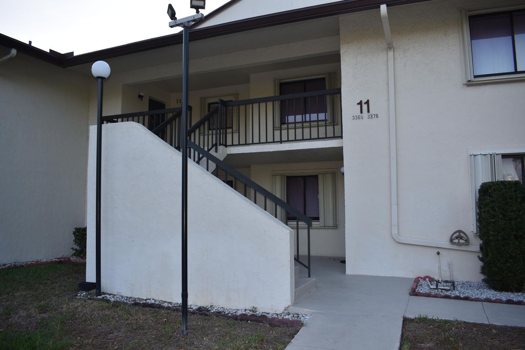 Photo of 3374 Perimeter Drive, Greenacres, FL 33467 (MLS # B26016080)