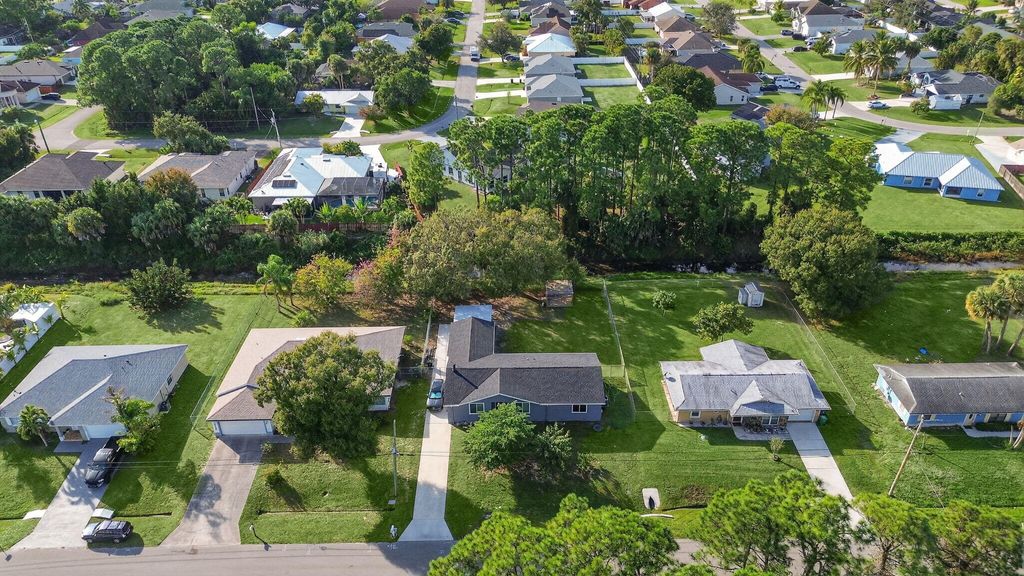 Photo of 3142 SW Bridge Street, Port Saint Lucie, FL 34953 (MLS # R11148110)