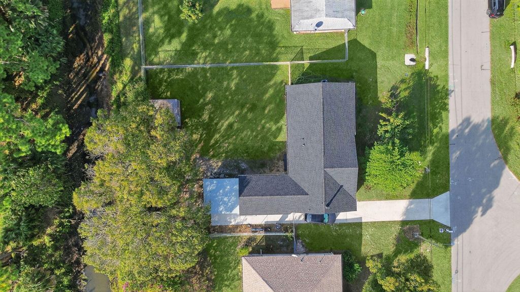 Photo of 3142 SW Bridge Street, Port Saint Lucie, FL 34953 (MLS # R11148110)