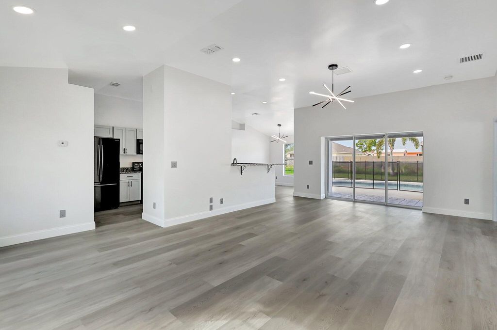 Photo of 457 SW Todd Avenue, Port Saint Lucie, FL 34983 (MLS # B26019333)