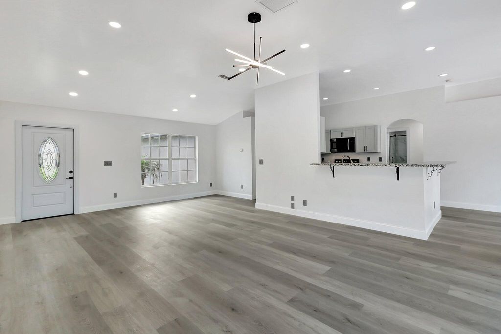 Photo of 457 SW Todd Avenue, Port Saint Lucie, FL 34983 (MLS # B26019333)