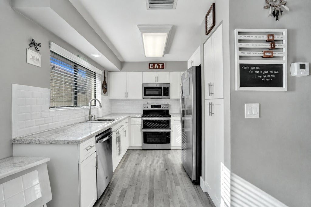 Photo of 9361 NW 18TH Drive, Plantation, FL 33322 (MLS # B26081193)