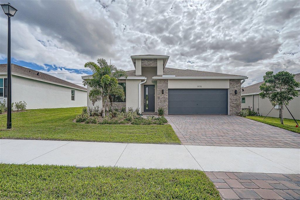 Photo of 1978 NE Ocean Dunes Drive, Jensen Beach, FL 34957 (MLS # R10935553)