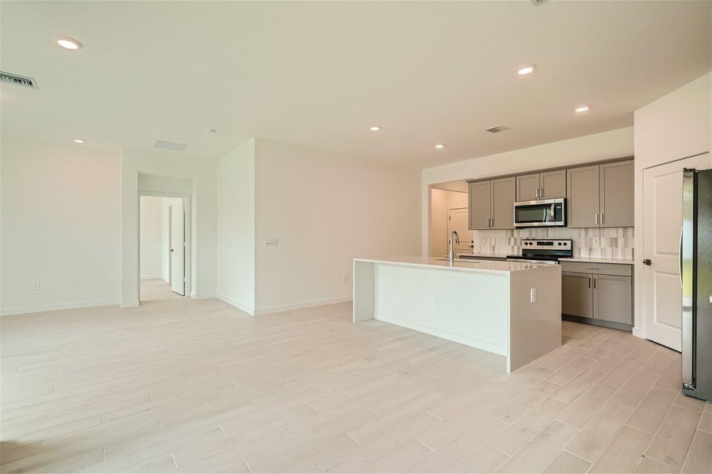 Photo of 1978 NE Ocean Dunes Drive, Jensen Beach, FL 34957 (MLS # R10935553)