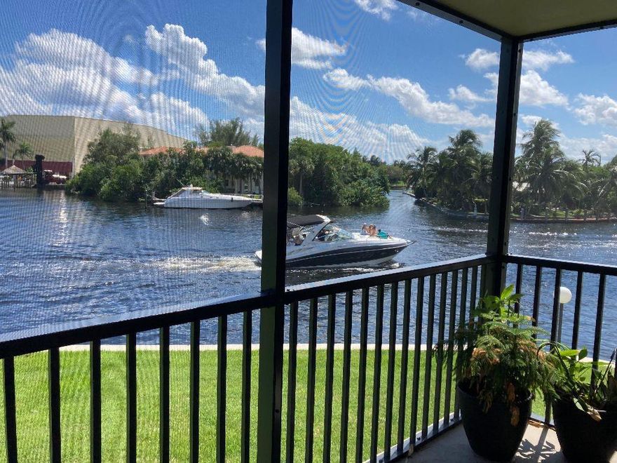 3/2 corner unit completely updated w/impact windows, washer & dryer in unit - and best views in all of Boca Bayou w/180 degree SE views of widest part of Hillsboro River leading to the Intracoastal Waterway, deepwater & dockage available up to 40ft boat w/very low dockage fees.  Amenities include guard gate, security, lighted tennis courts, fitness center, sauna, bocce ball, walking paths, BBQ grills, clubhouse, multiple pools - all in very desirable Boca Bayou!