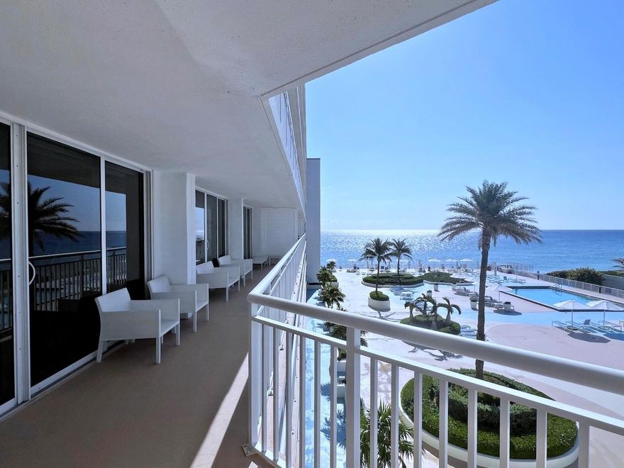 Enjoy breathtaking Ocean Views from the kitchen, dining, and living areas, all with direct access to an expansive 43-foot oversized balcony. This beautifully renovated 3-bedroom, 2.5-bath sunny residence offers over 2,400 sqft of luxurious living space, showcasing stunning southeast-facing views of both the Ocean and Pool. The chef-inspired open kitchen has been magnificently renovated and features a designer island, quartz countertops, high-end appliances, cabinet lighting, a sleek range hood, a built-in wine fridge, and custom built-in cabinetry. Modern vinyl flooring flows seamlessly throughout the home, enhancing its clean, contemporary design. The spacious primary suite offers a large walk-in closet and an oversized bathroom complete with a soaking tub and walk-in shower.