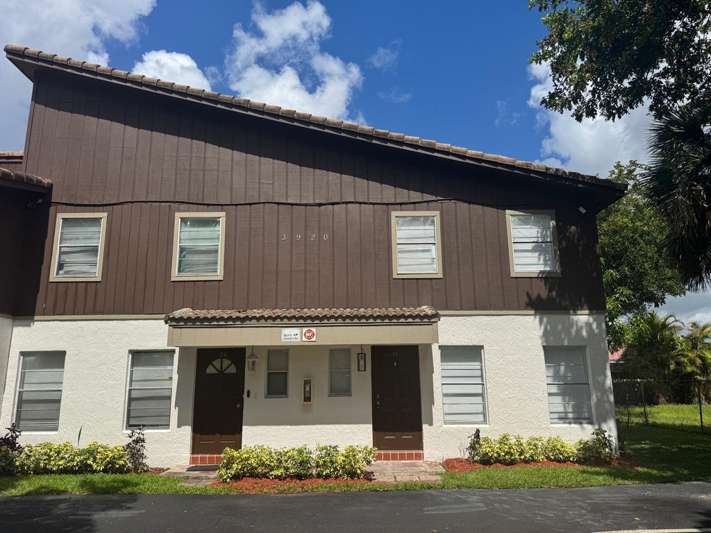 Photo of 3920 Woodside Drive #14, Coral Springs, FL 33065 (MLS # B26049257)